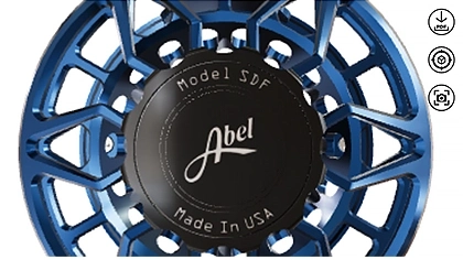 Close-up of an Abel fly fishing reel showing the 'Made in USA' engraving on the reel body