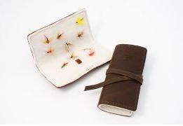 The Book of Flies (Fly Keeper) is the best place to store your fly fishing flies with a Rustic Flare. The Fly Keeper can hold up to 20 flies and is handcrafted with top grain leather. A soft, felt-lined interior provides an ideal spot for hooking and storing your flies. A leather wrap closure helps secure the flies inside. Small enough to be very portable, but big enough to store a good number of tied flies, the Book of Flies is sure to be a hit while out on a fishing trip (Note, flies not included).